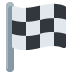 Bandera de carreras a cuadros blancos y negros sobre un mástil gris.