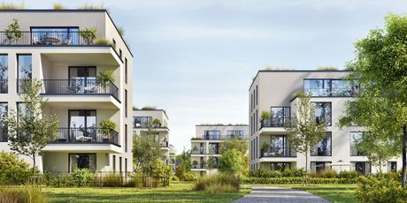 Immeubles d’appartements modernes avec balcons et espaces verts dans une résidence ensoleillée