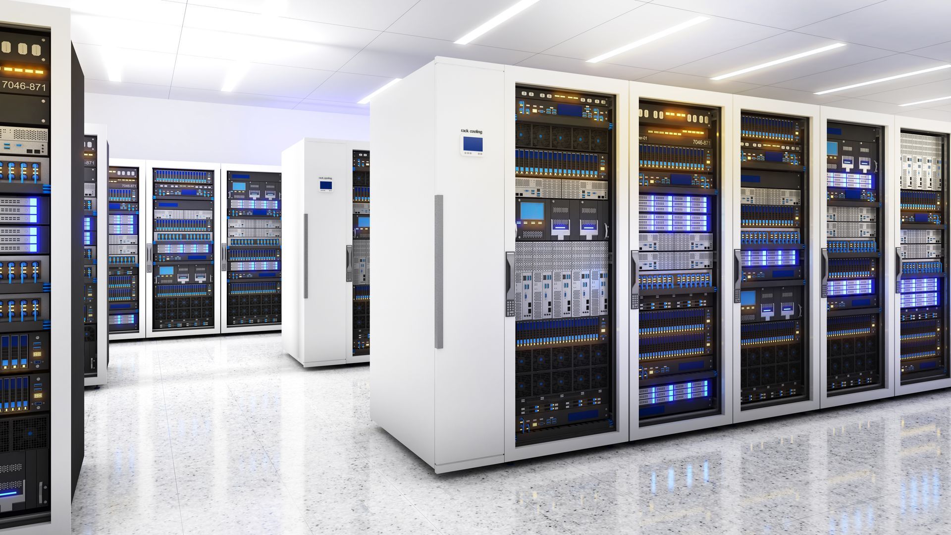 A row of white server racks stands on a polished, light-colored floor in a bright, modern data center.