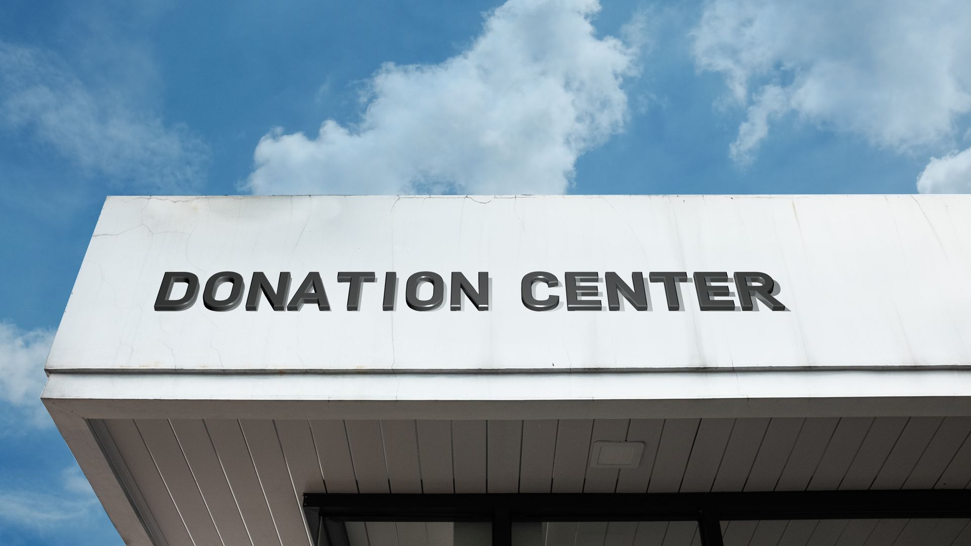 A white sign with black text reading