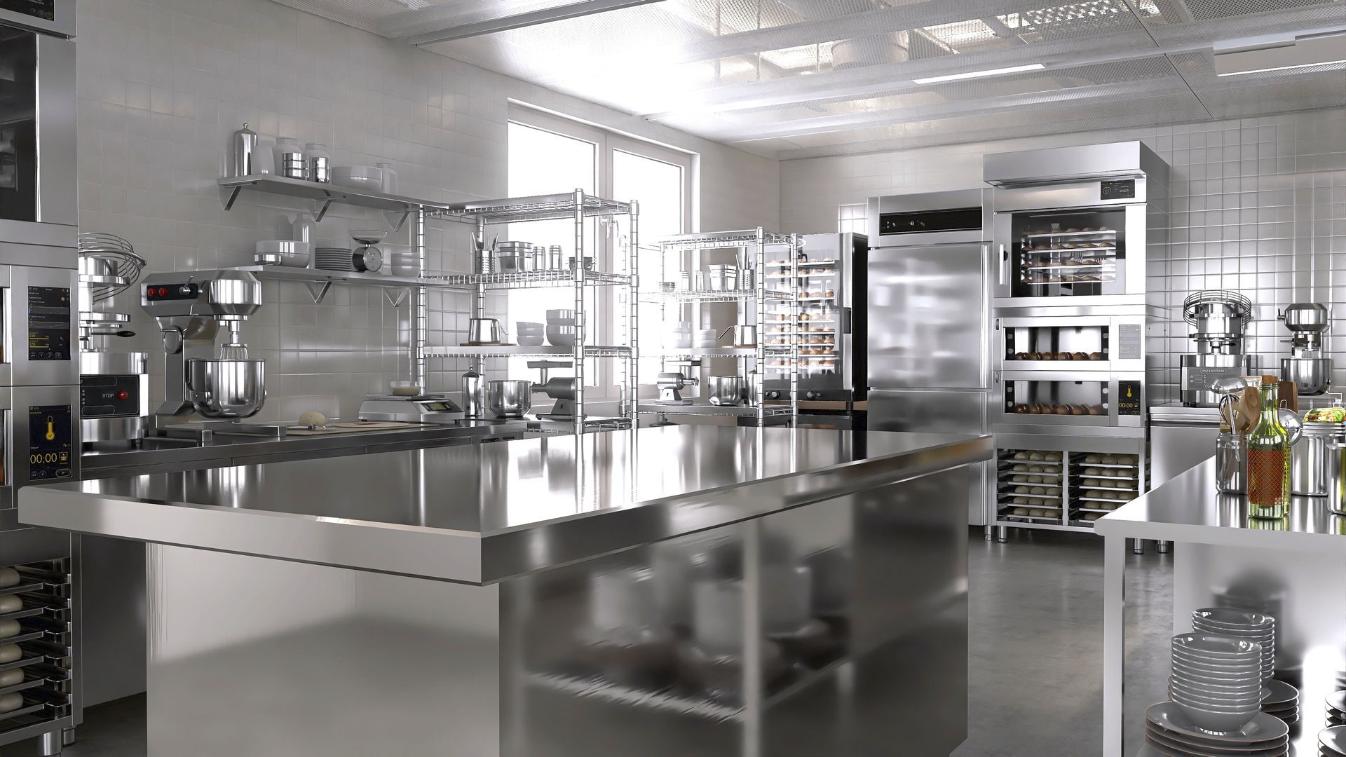 A bright, modern commercial kitchen with stainless steel countertops, professional appliances, and wire shelving.