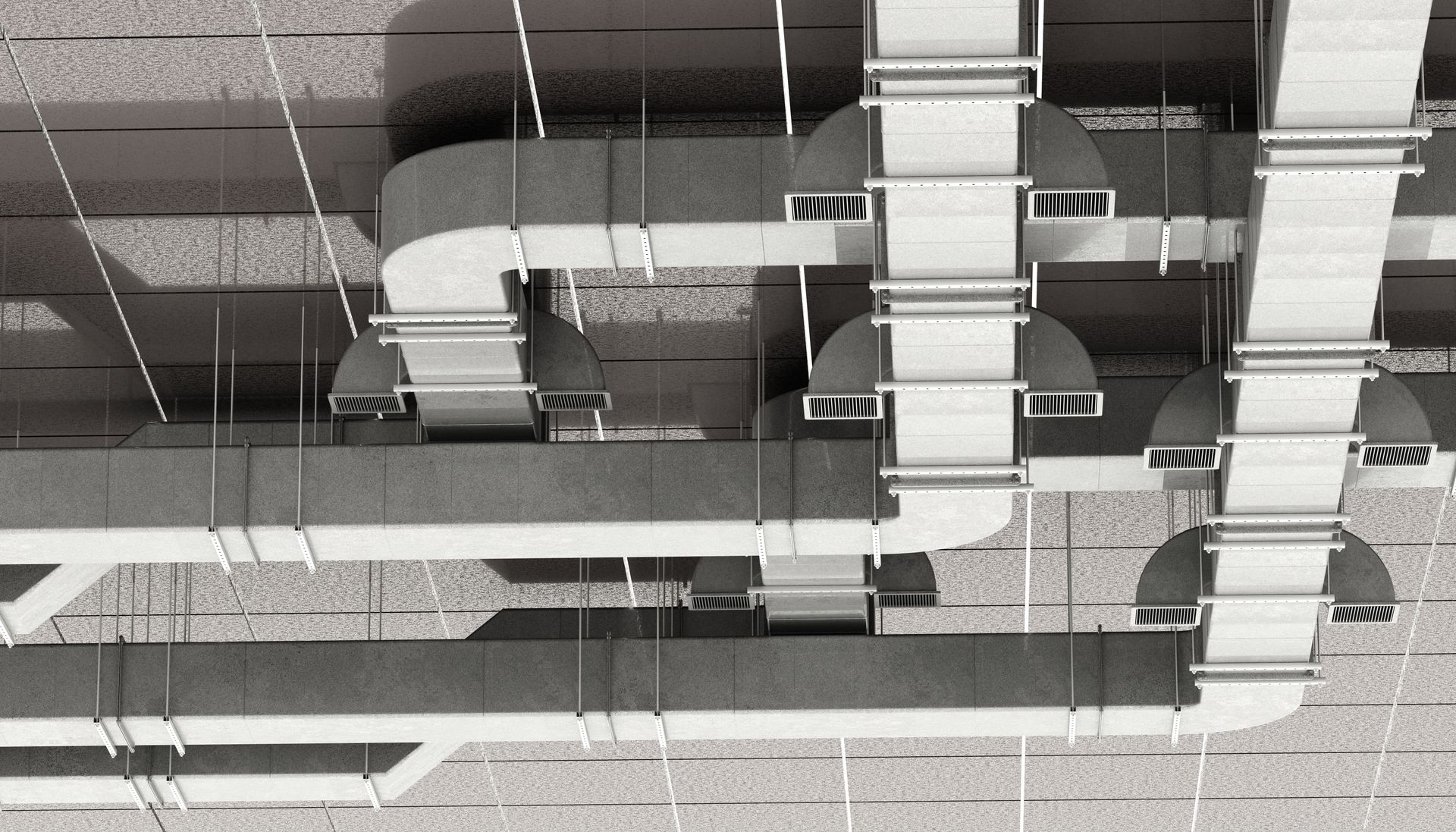A view looking up at a complex network of industrial ventilation ducts, pipes, and hanging supports on a ceiling.