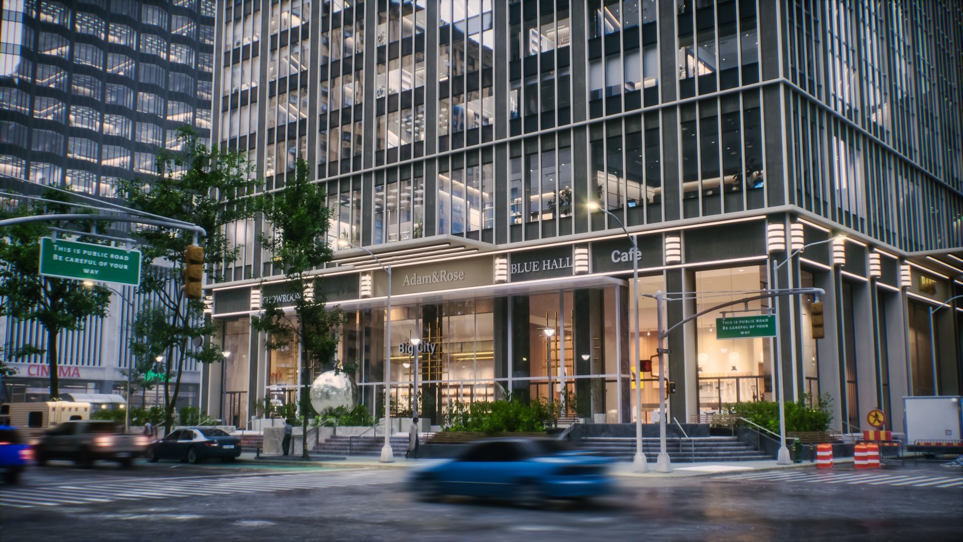 A modern, glass-walled office building on a city street corner, with cars passing in front at dusk.