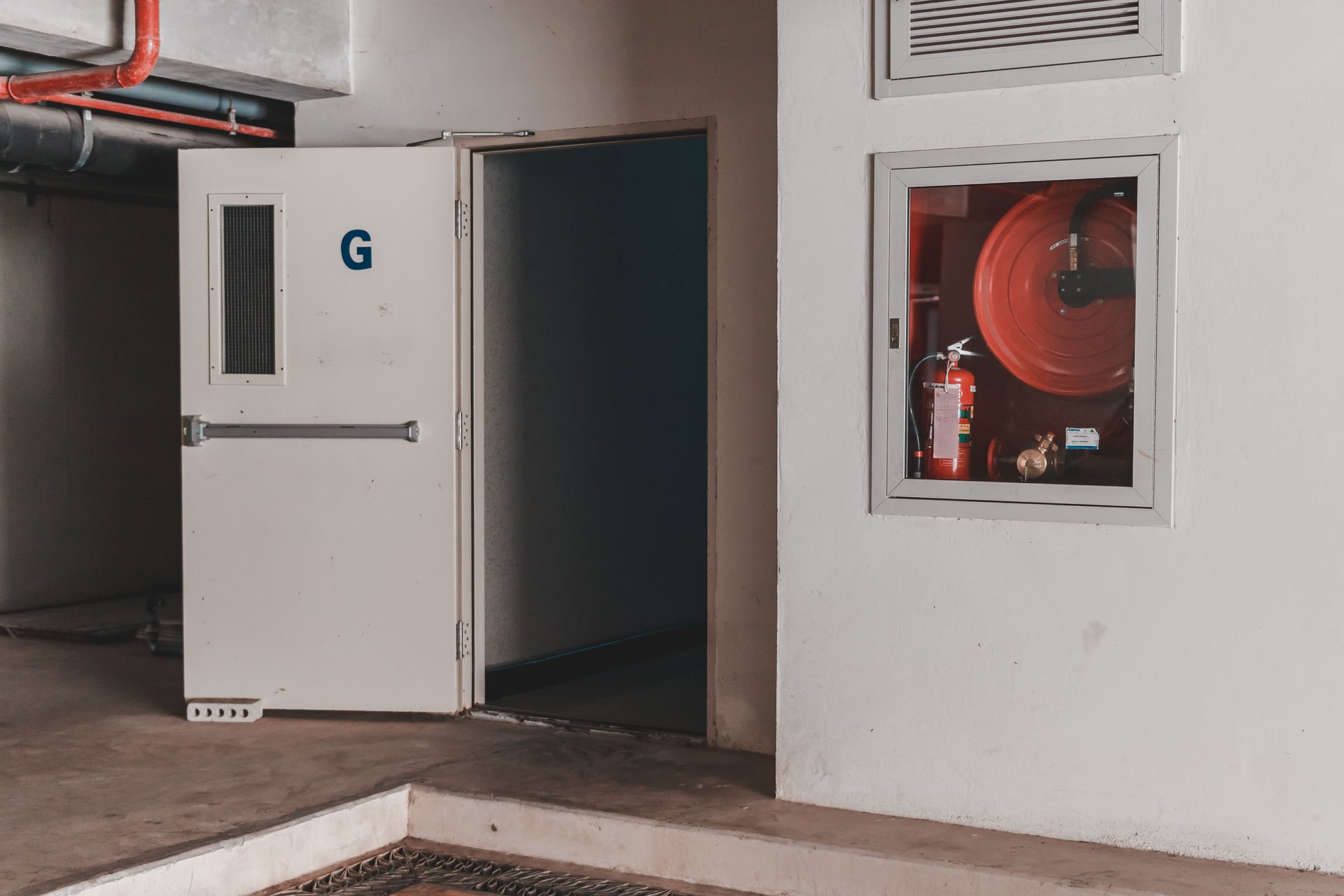 A white emergency exit door labeled