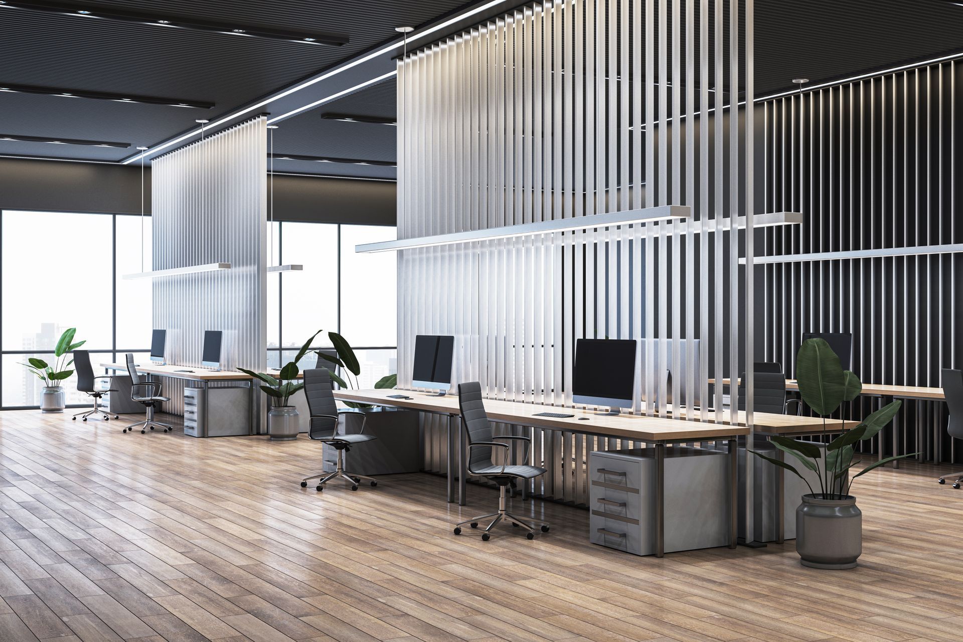 Modern office workspace with desks, chairs, and vertical slat dividers, featuring wooden floors and large windows.