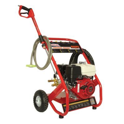 A red and black high pressure washer with a honda engine