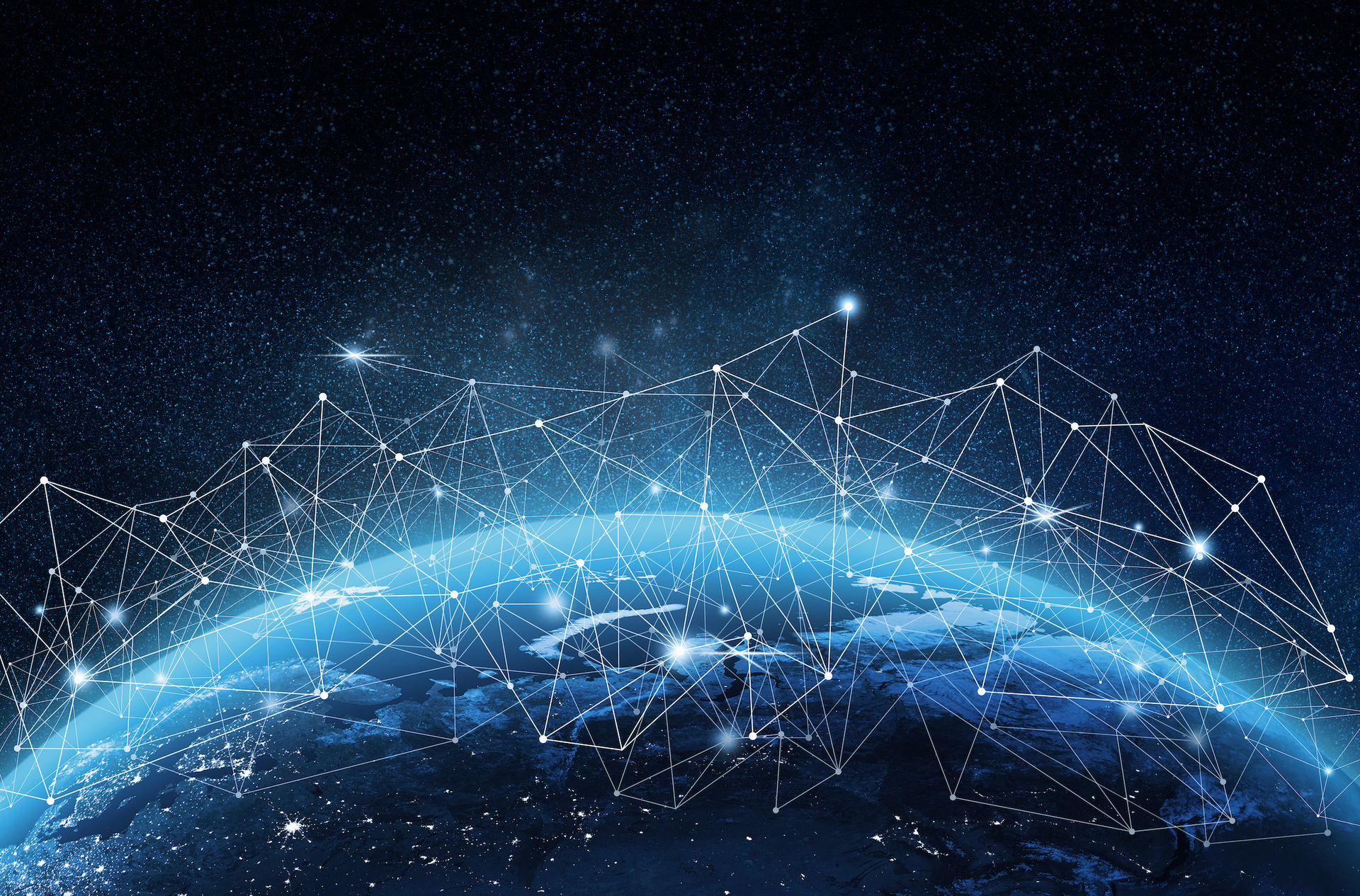 A computer generated image of the earth in space with a network of connections.
