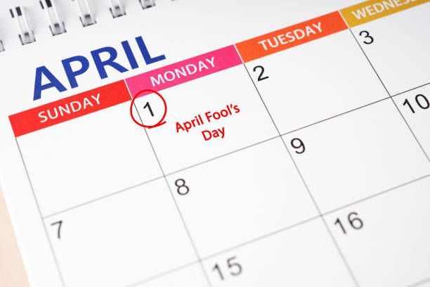 A wall calendar showing April, with the first day circled and labeled
