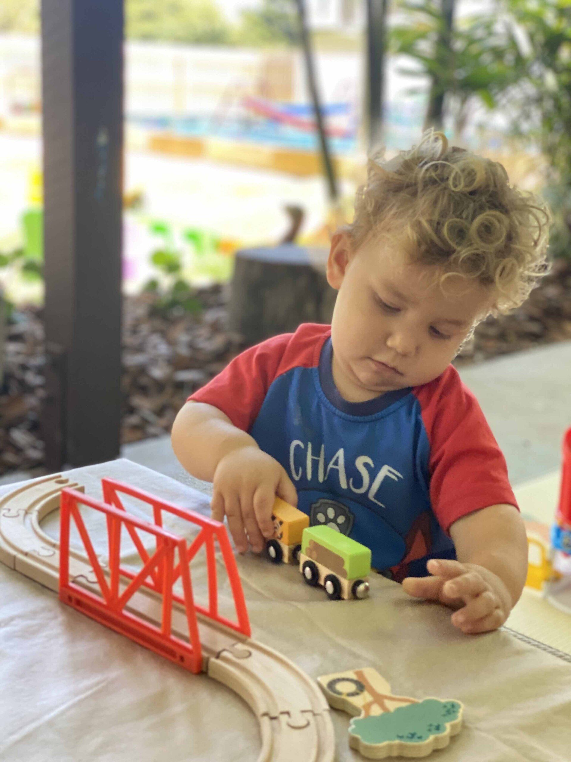 Little Boy Playing Train Toy — Emu Park, QLD — Coastal Kids