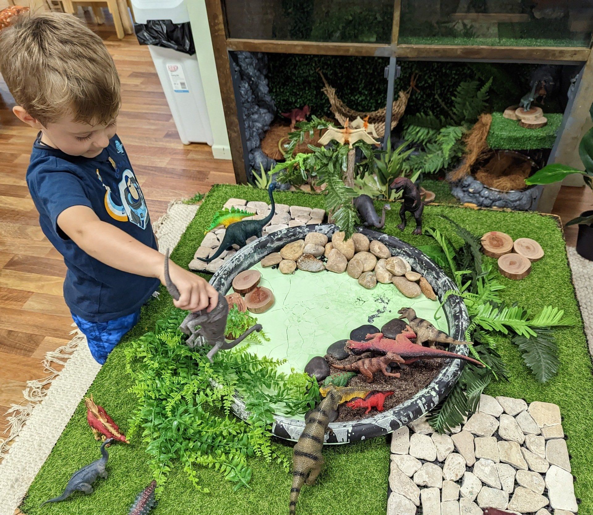 Little Boy Playing Dinosaur Toys — Emu Park, QLD — Coastal Kids