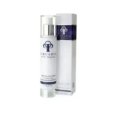 White Acadia skincare bottle and box with navy label on a white background