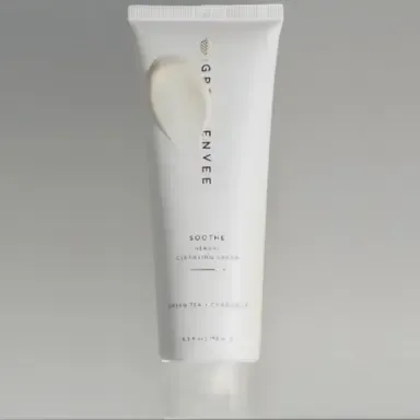 White skincare tube labeled “GIVEN ENVE” on a light gray background