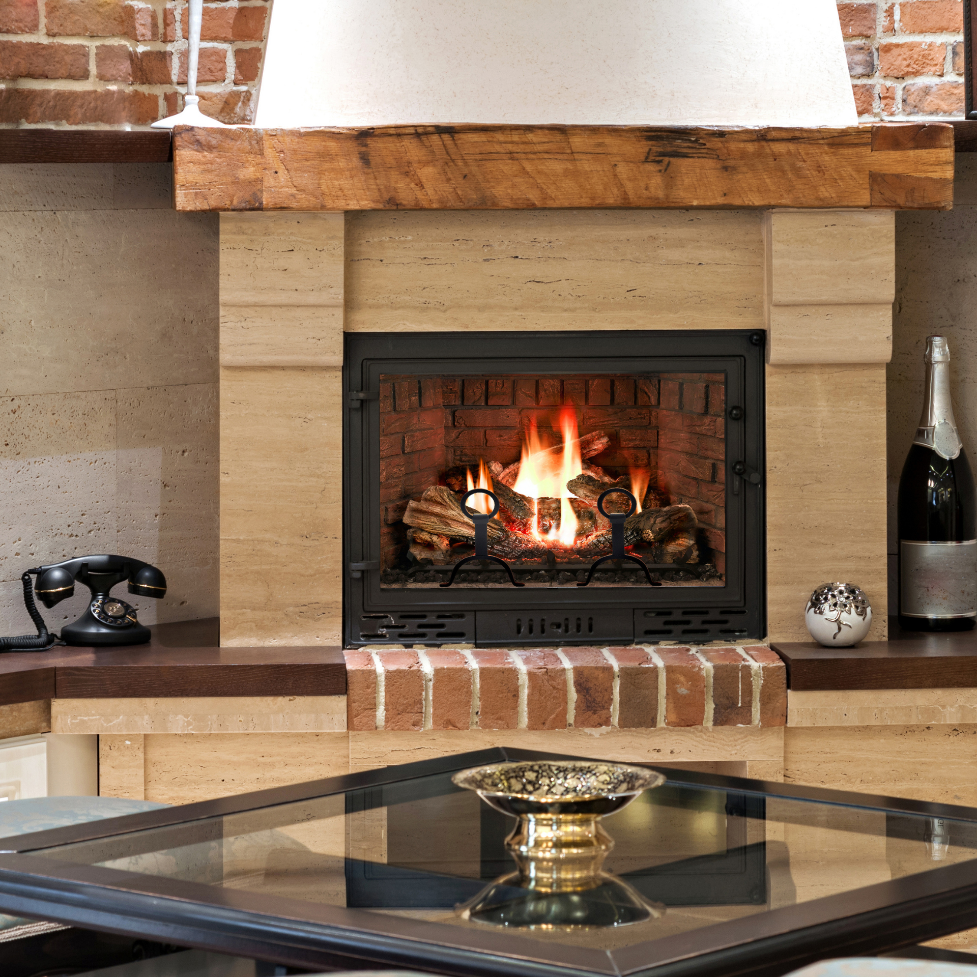 A fireplace with a glass table in front of it
