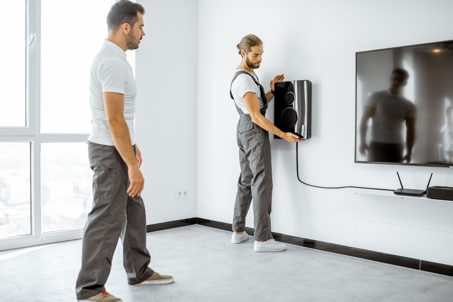 Installing luxury audio system in the white living room