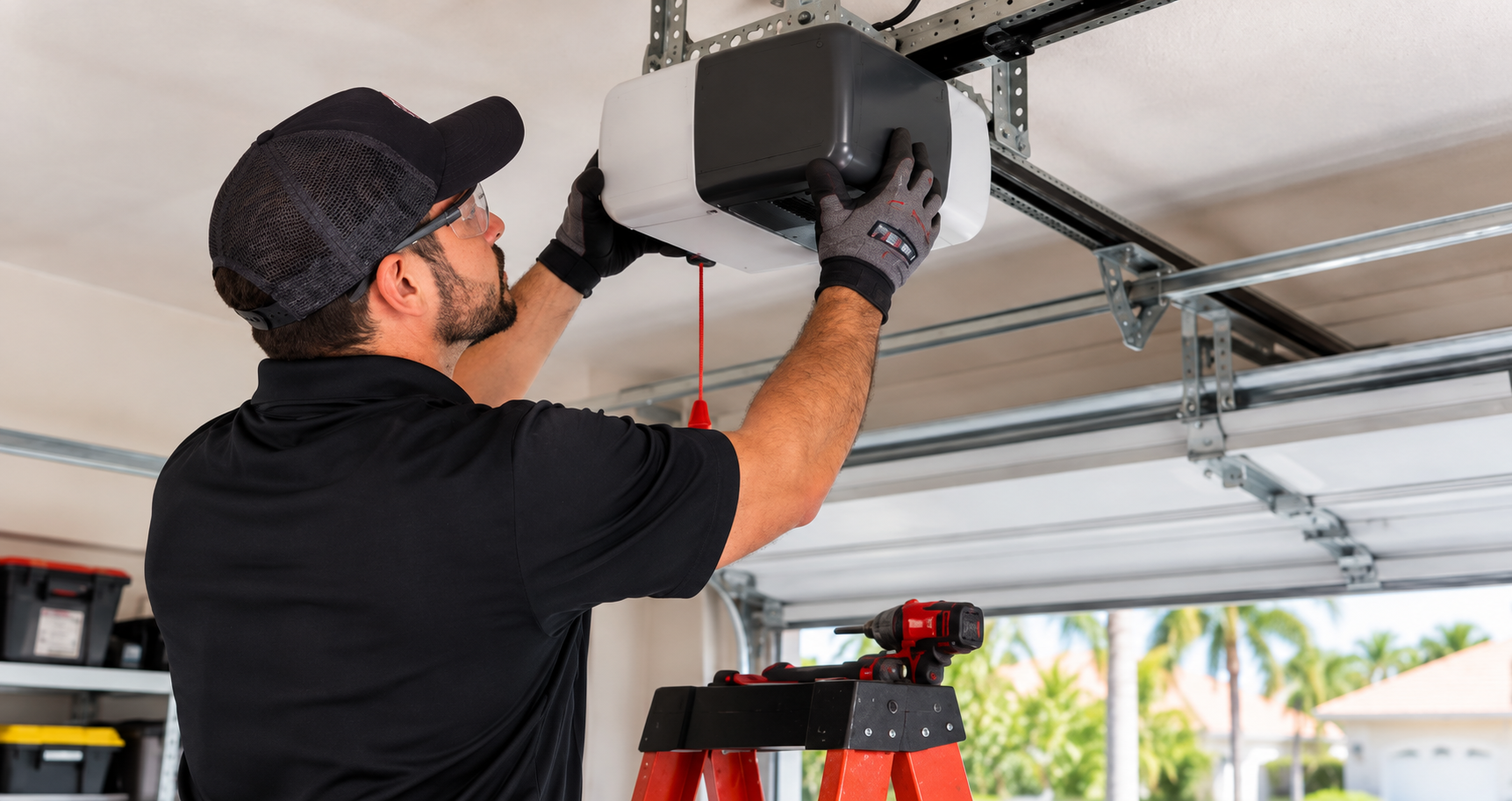 Garage door technician replacing an overhead garage door opener motor in a residential garage
