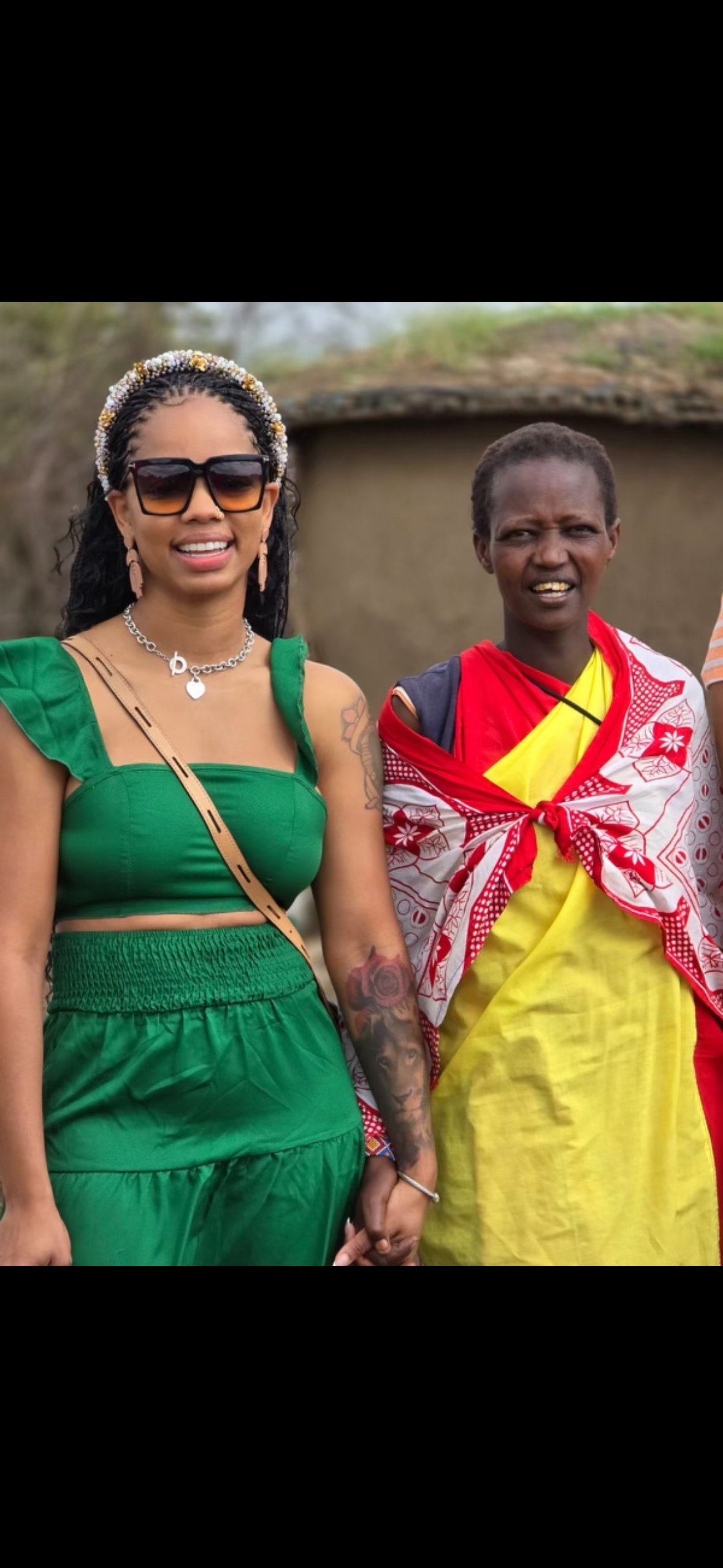 A woman in a green dress is standing next to a woman in a yellow dress.