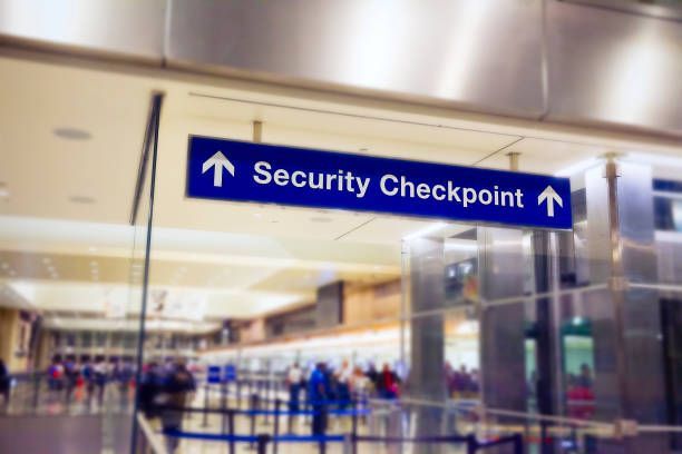 A blue sign that says security checkpoint on it