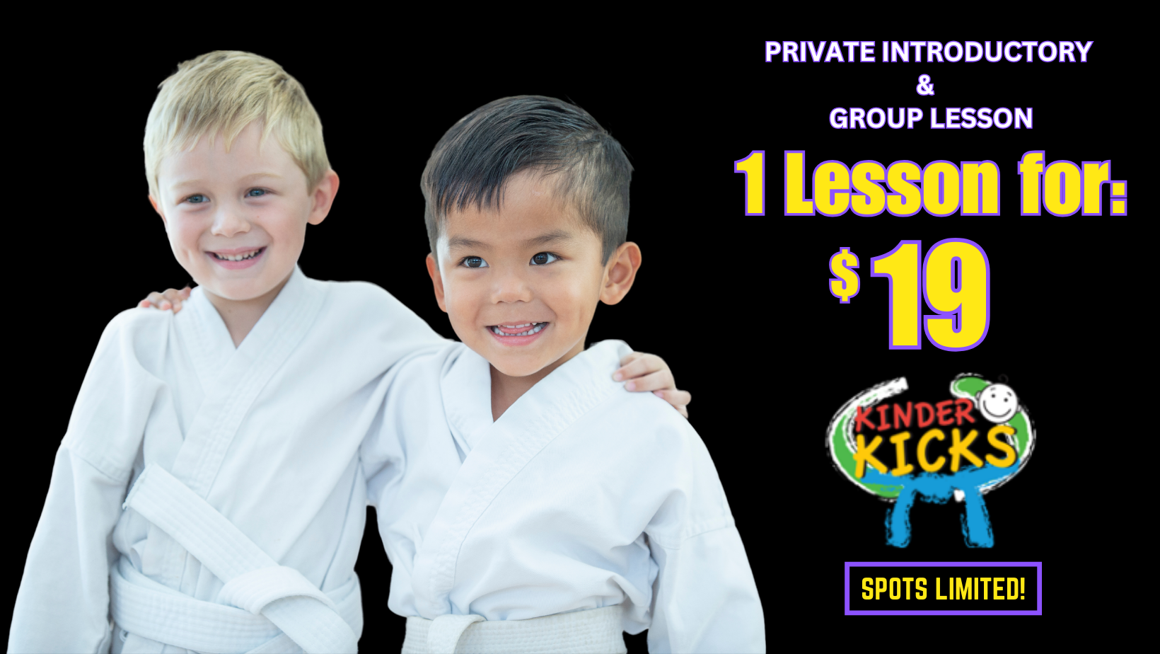 Two young boys in karate uniforms are standing next to each other.