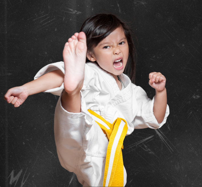 A group of young children are practicing karate together.