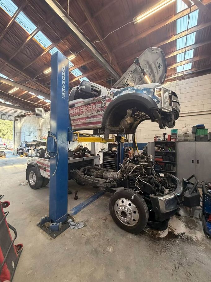 Truck lifted up in our garage | Nampa Auto Repair & Diesel