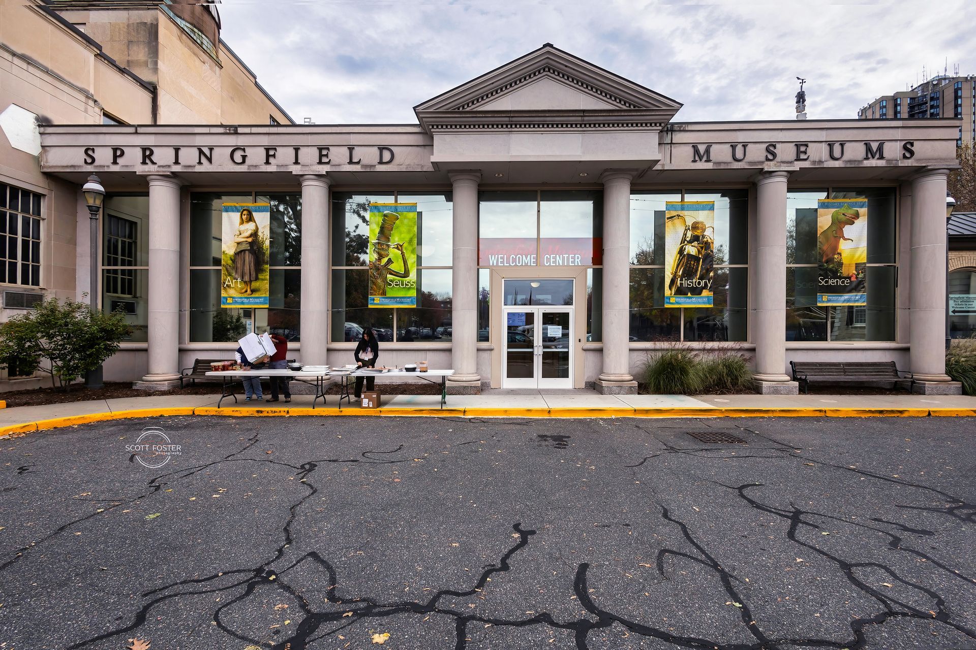Springfield Museums building with columns and large windows; an overcast day with leaves on the ground.
