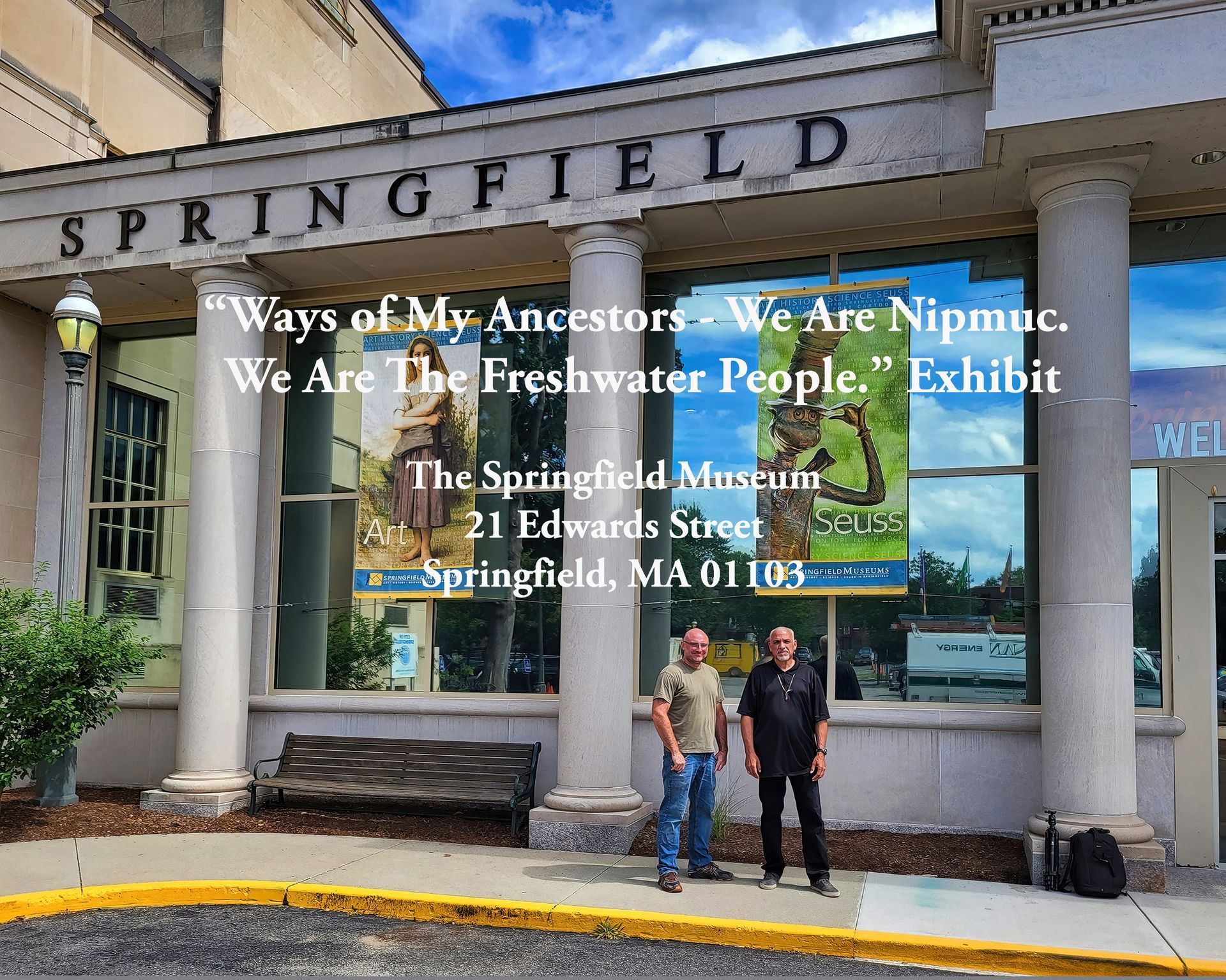 Two men in front of the Springfield Museum. Exhibit banners read,