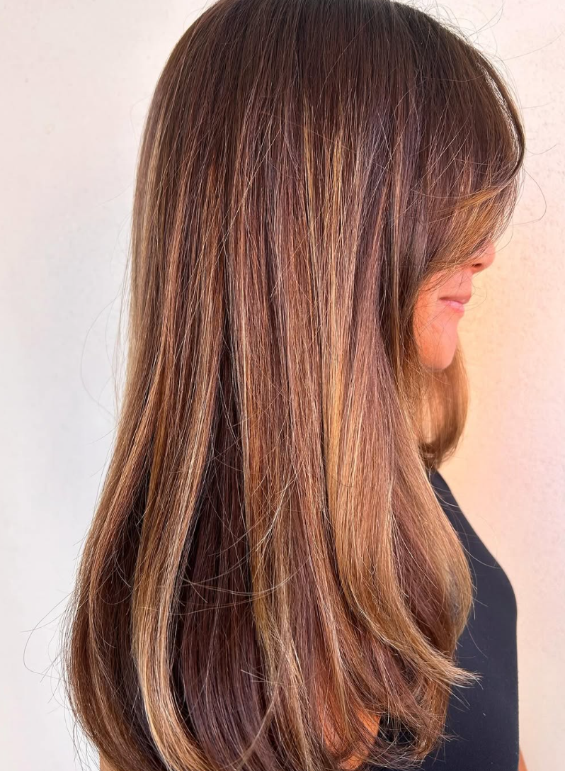A Girl Having Her New Hair Color in the Salon — Hairdressers At Work in Cairns City, QLD