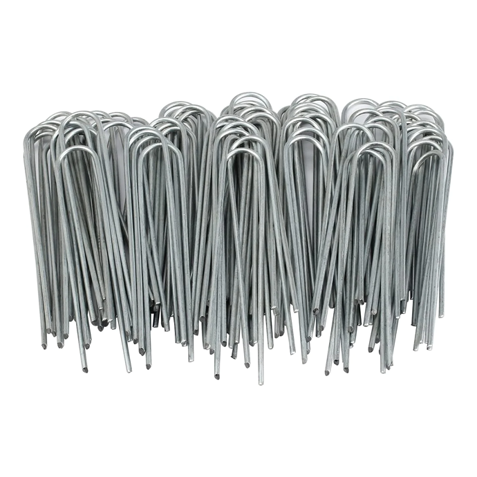 Bundle of silver metal U-shaped garden stakes on a white background