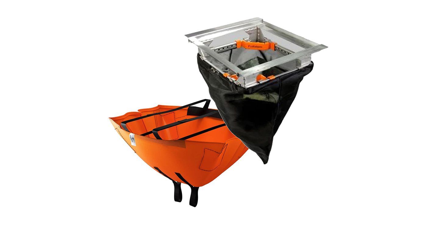 Two orange-and-black outdoor bins with black liners and silver rims on a white background