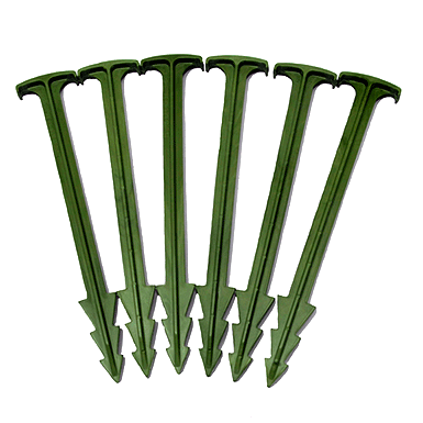 Five green plastic stakes arranged in a fan shape on a white background