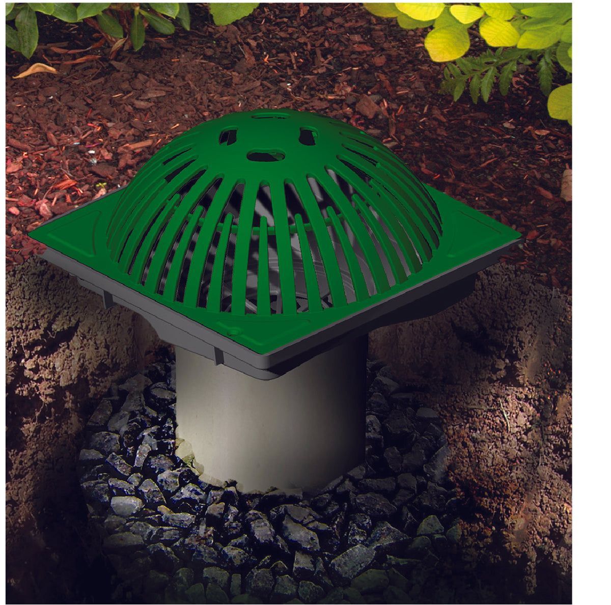 Green dome-shaped garden drain cover on a concrete pipe, set in mulch and plants outdoors