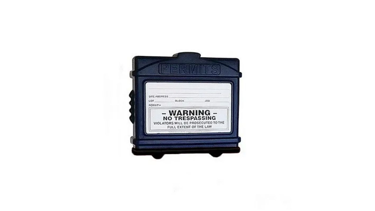 Black industrial warning box with a white caution label on the front