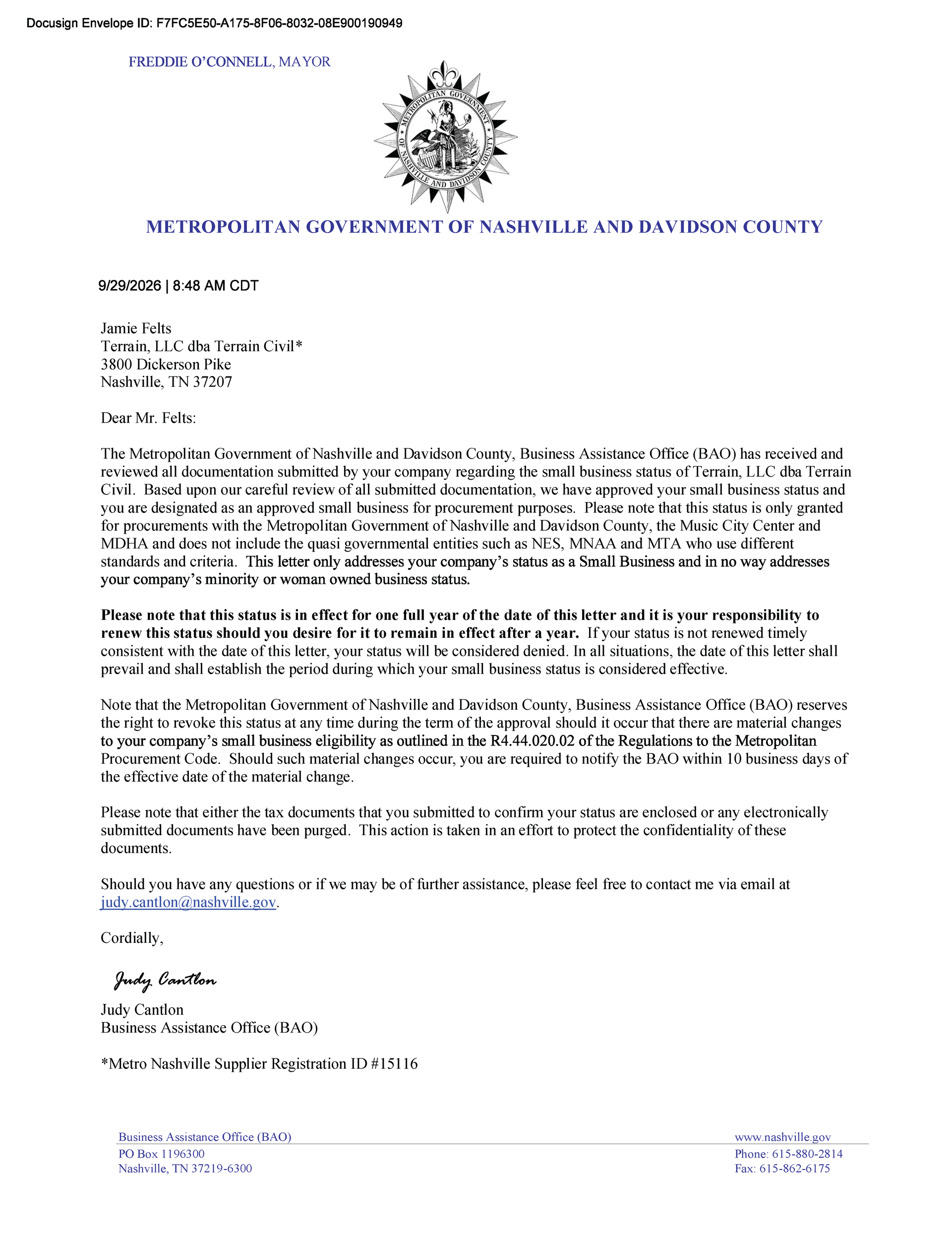 Blurred formal letter on white paper with official crest and dense black text, likely a government notice