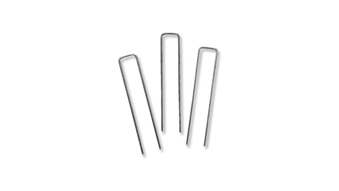 Three silver nail files standing upright on a white background