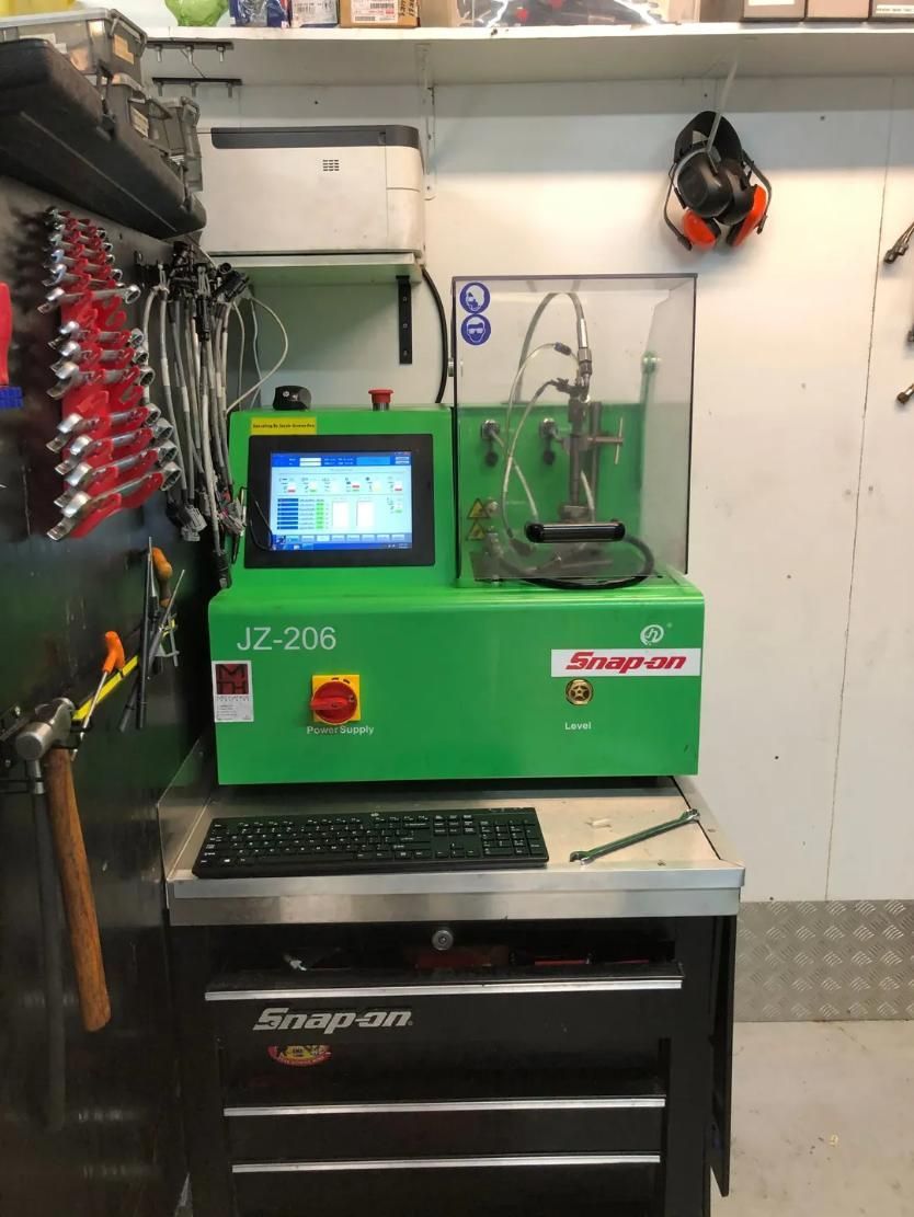 A Green Snap-on Machine Is Sitting On Top Of A Desk — Reef Diesel Injection In North Mackay, QLD