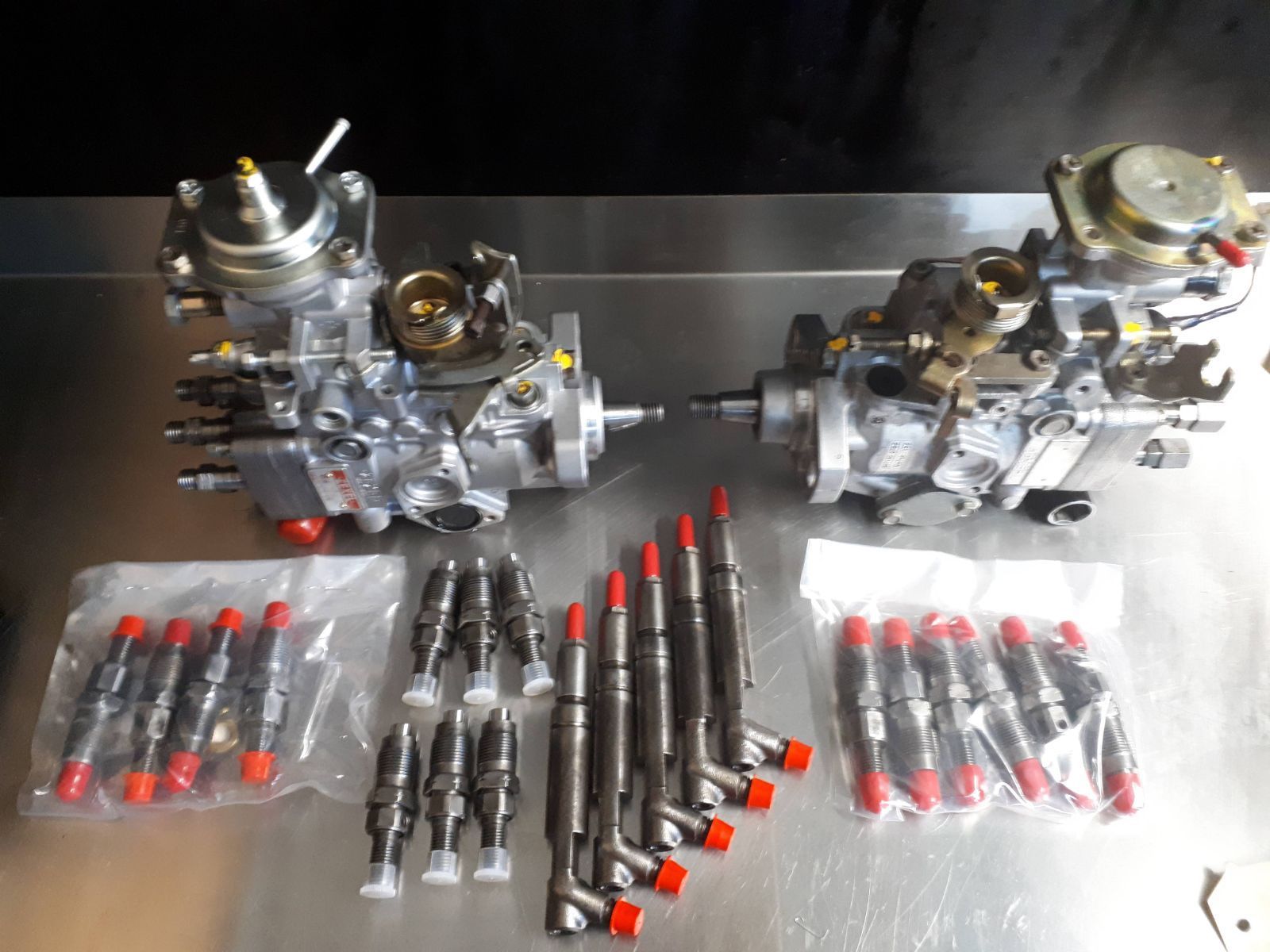 Fuel Injectors and pumps on a table — Reef Diesel Injection In North Mackay, QLD