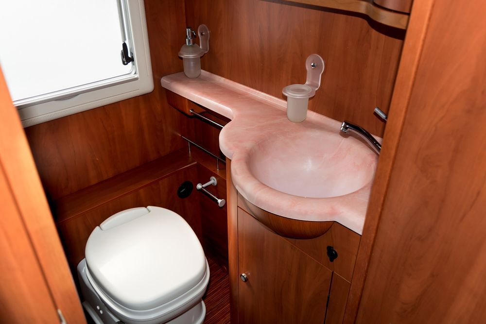 Open, Tinted Window on a White Caravan — Total Caravan Repairs in Taree, NSW