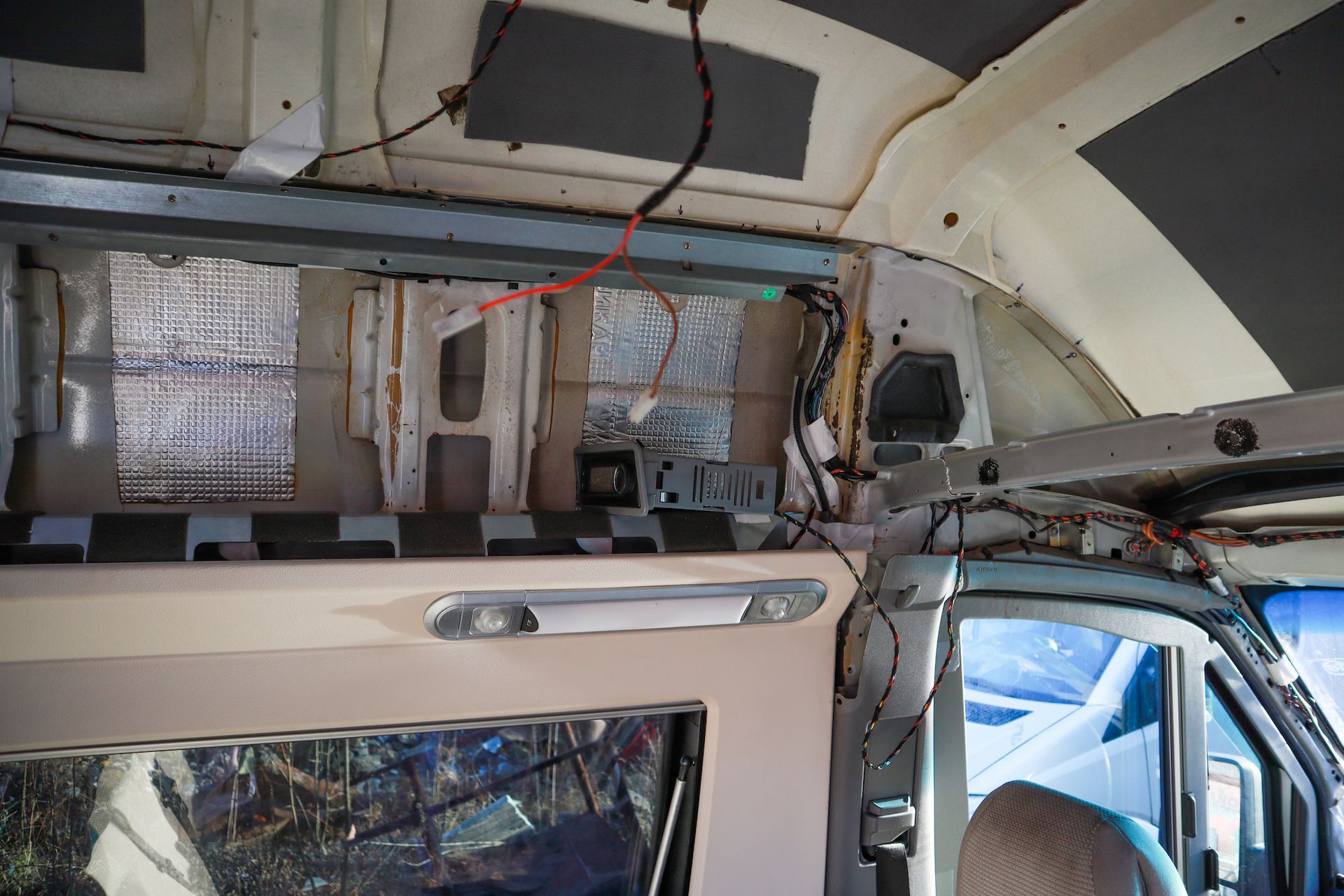 Interior of a Van Undergoing Conversion, Showing Insulation and Wiring — Total Caravan Repairs in Forster, NSW