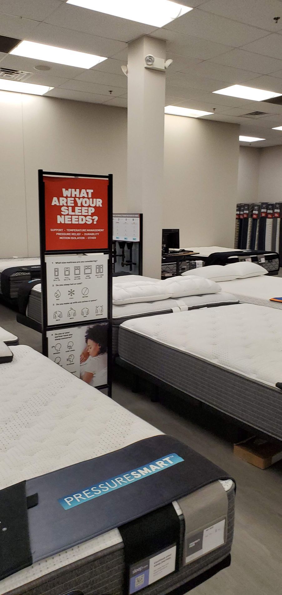 Mattresses on display in a store.