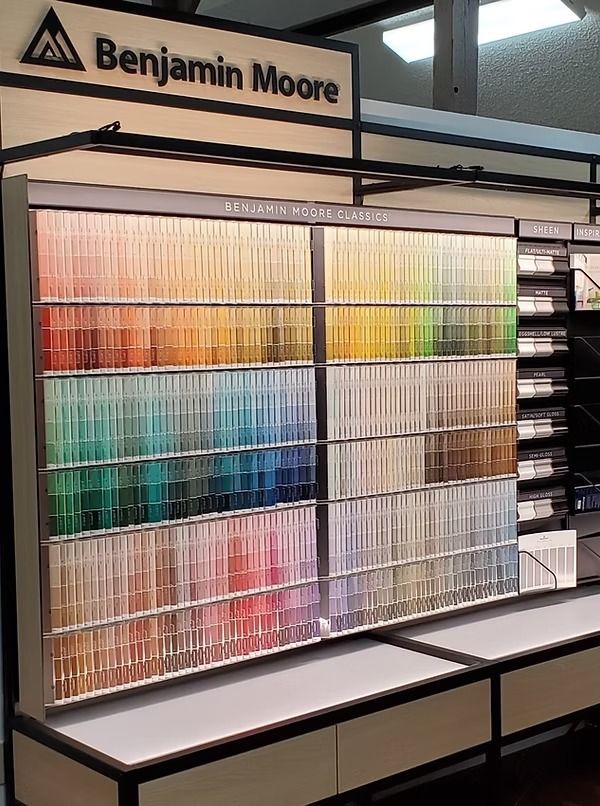 Benjamin Moore paint color display with rows of sample swatches in a store