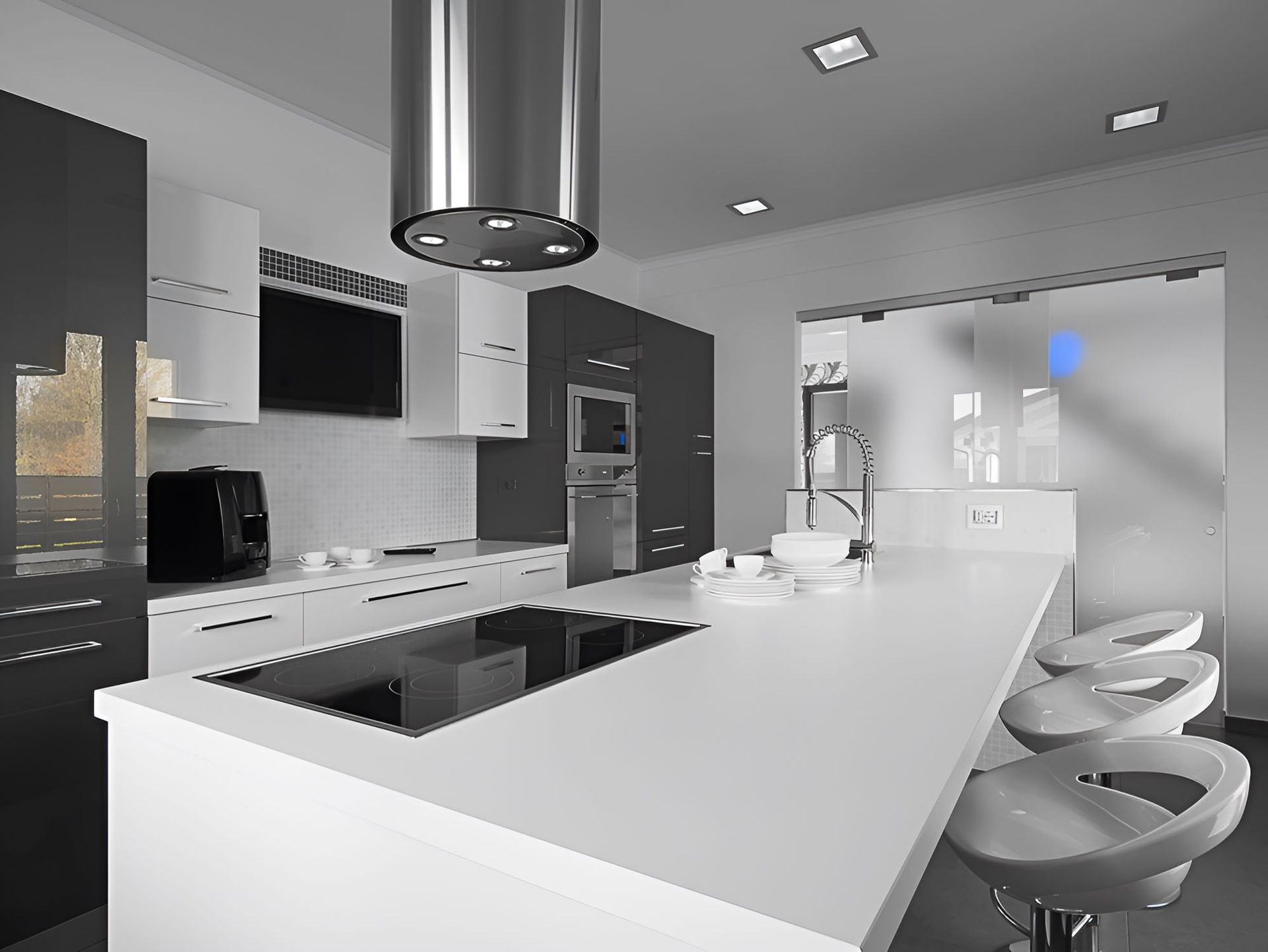 A Kitchen With a Large Island and a Stove Top Oven — Accurate Tiling MNC In Dunbogan, NSW