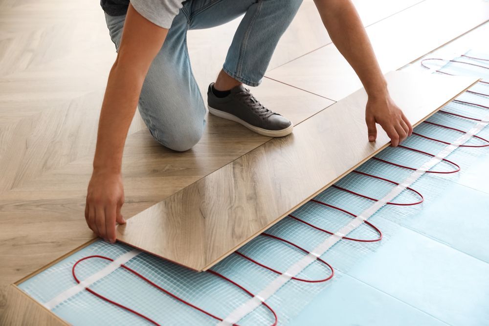 A Close Up of a Drain on the Floor of a Bathroom — John Chisholm Flooring in Mission Beach,  QLD