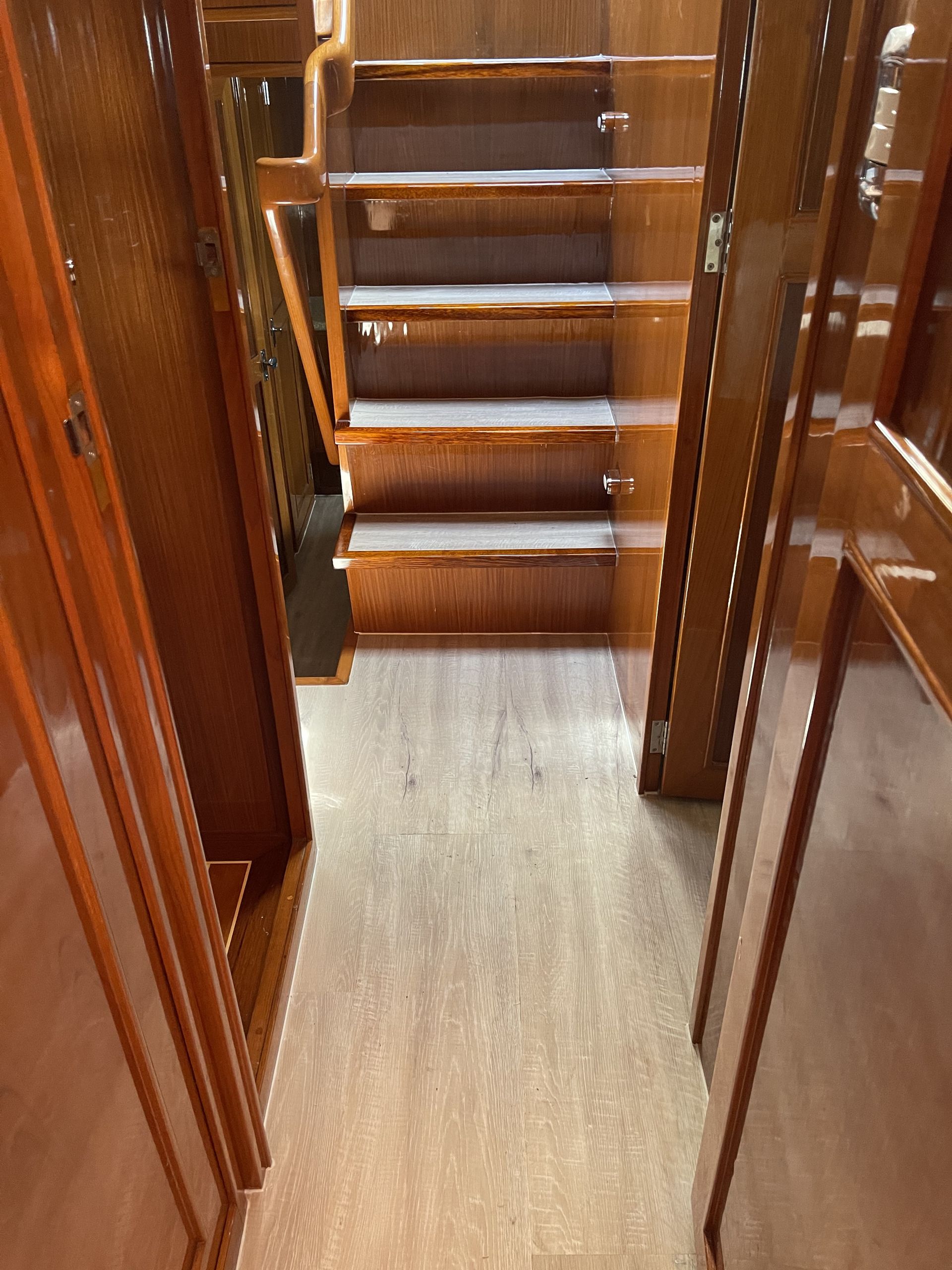 The Inside of a Boat With Blue Seats and a Steering Wheel — John Chisholm Flooring in Manunda, QLD