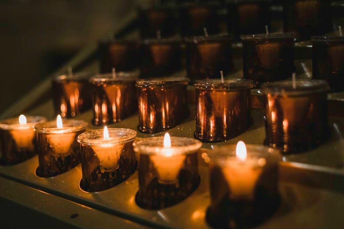 Memorial candles glowing softly for funeral and cremation services in River Grove, IL