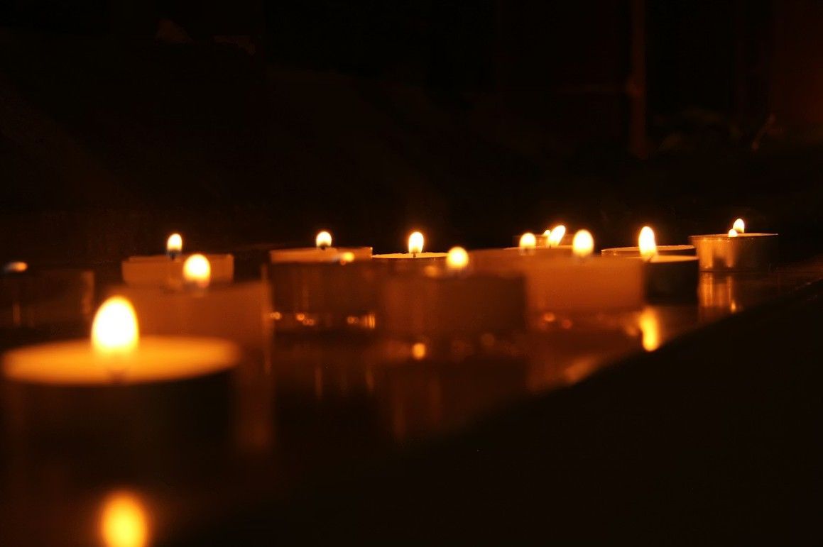 Memorial candles glowing softly for Schiller Park, IL funeral and cremation services