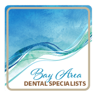 A logo for bay area dental specialists with a blue and green wave
