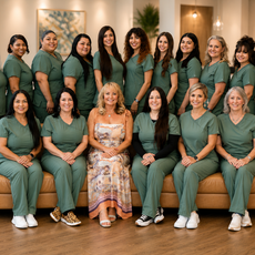 A group of women holding a sign that says dentistry 4 children