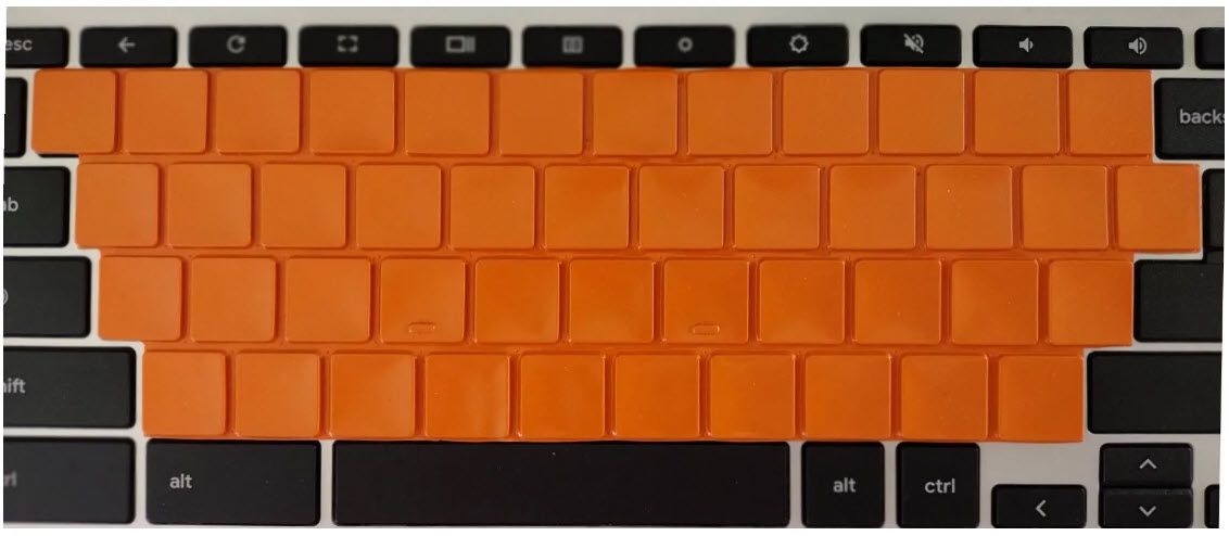 A SpeedSkin UltraSlim keyboard cover on a standard laptop. These covers fit older laptops with beveled / slanted keys.