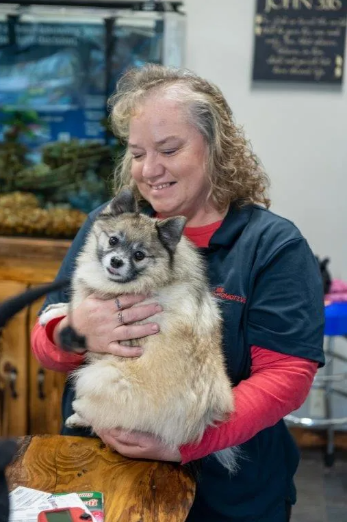 Karin With a Dog at 808 Automotive Inc. - Hubbard Auto Repair