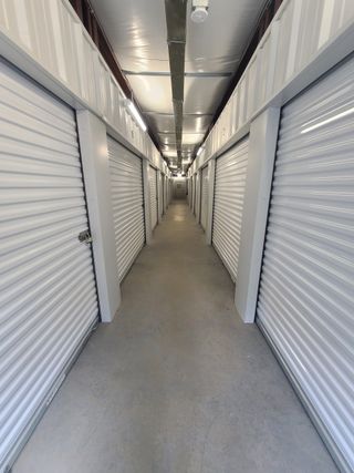 Person Storing His Items — Youngsville, NC — A Storage Place Person Storing His Items — Youngsville, NC — A Storage Place